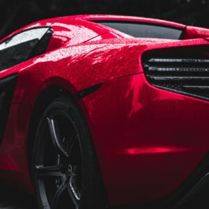 A red car looking perfect after getting a paint correction in new jersey by on point detail pro