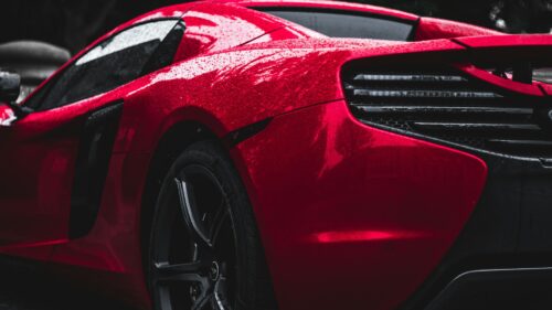 A red car looking perfect after getting a paint correction in new jersey by on point detail pro