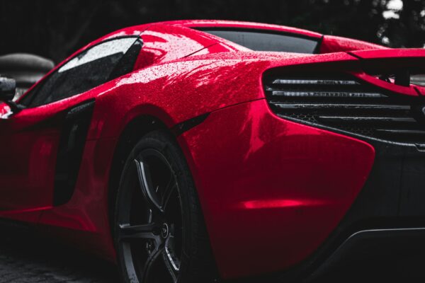 A red car looking perfect after getting a paint correction in new jersey by on point detail pro